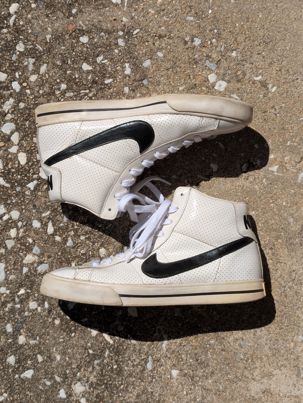 Nike White High-Top Leather Sneakers with Black Swoosh